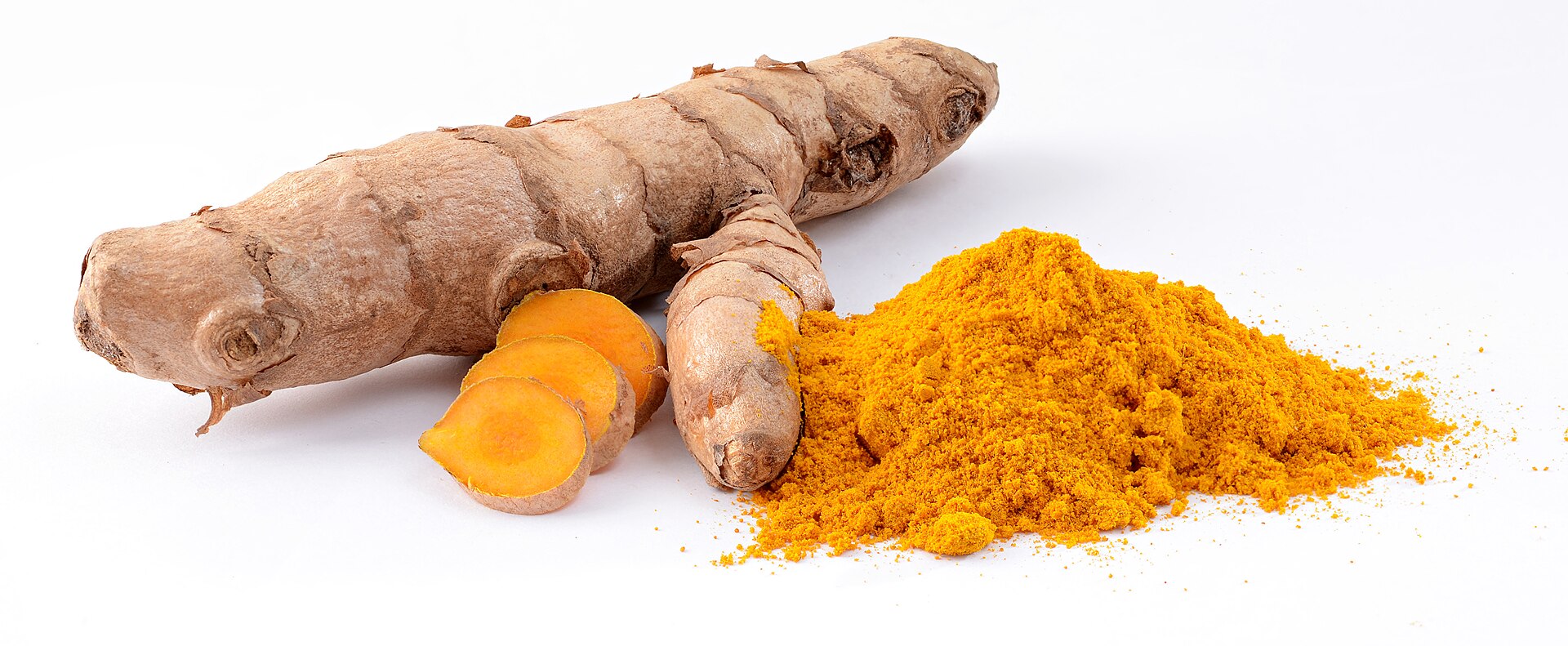 Fresh turmeric root, sliced turmeric showing orange interior, and a small pile of ground turmeric powder
